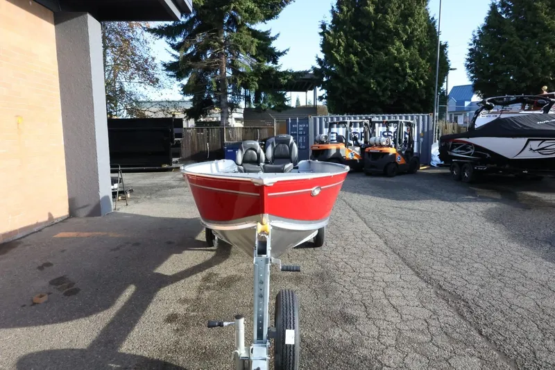 Slide: The Image of 2026 Lund 1600 Fury Tiller boat in a parking lot, front view. - 3