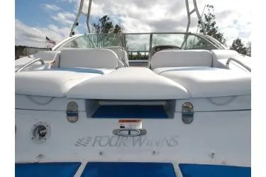 Slide: The Image of 2005 Four Winns 190 Horizon boat, rear view with seating and logo. - 13