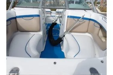 Slide: The Image of 2005 Four Winns 190 Horizon boat interior with white and blue seating. - 9
