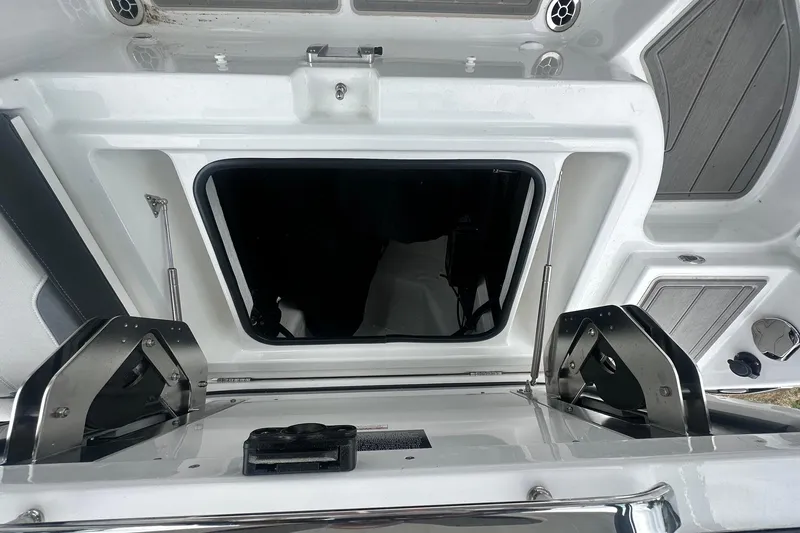 Slide: The Image of Open hatch of 2026 Monterey Elite 25 OB boat, showcasing sleek design and modern features. - 21