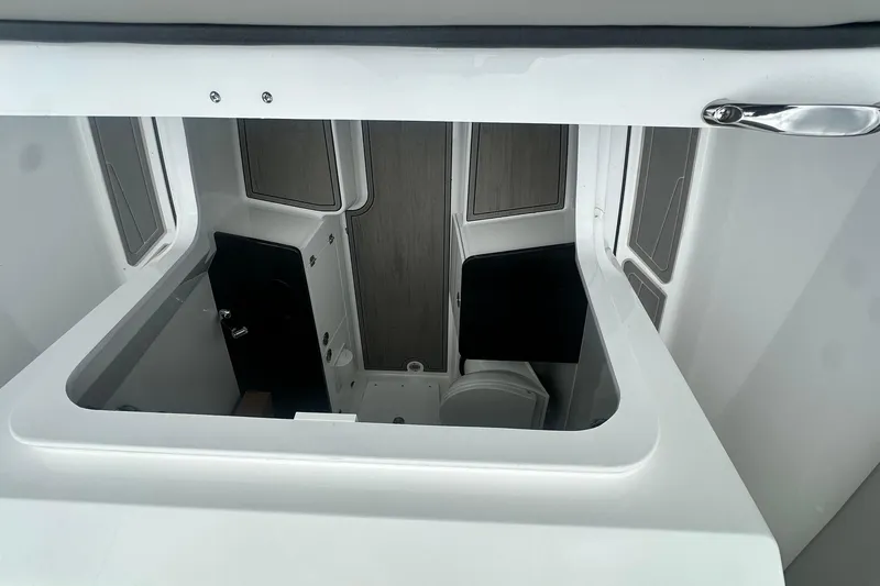 Slide: The Image of Interior view of 2026 Monterey Elite 25 OB boat cabin with modern design. - 27