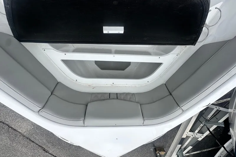 Slide: The Image of Interior seating of 2026 Monterey Elite 25 OB boat, featuring sleek gray upholstery. - 29