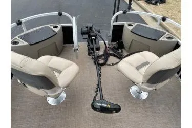 Slide: The Image of 2020 Sun Tracker Bass Buggy 18 DLX interior with seating and trolling motor. - 8