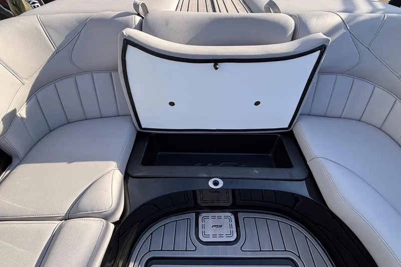 Slide: The Image of 2026 MB B52 23 Classic boat interior with open storage compartment and cushioned seating. - 18