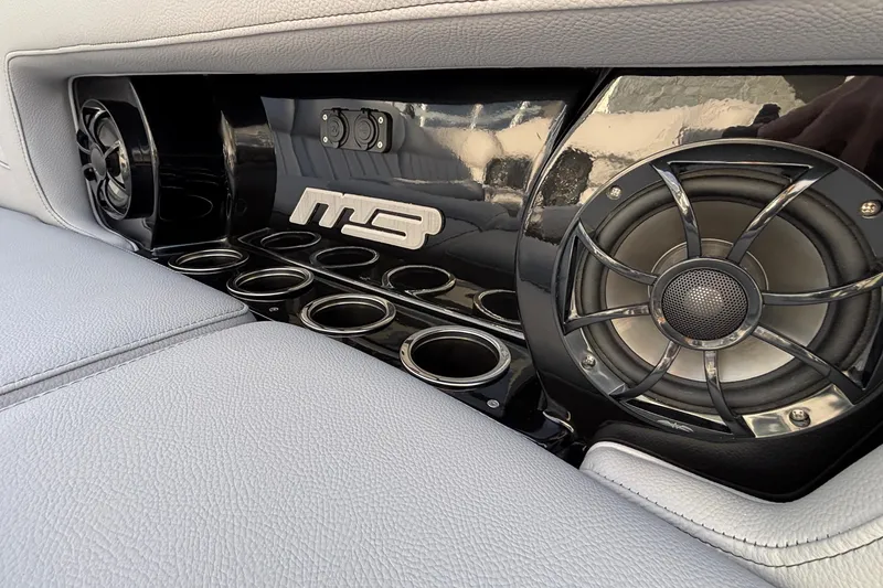 Slide: The Image of Interior of 2026 MB B52 23 Classic with premium audio system and cup holders. - 19