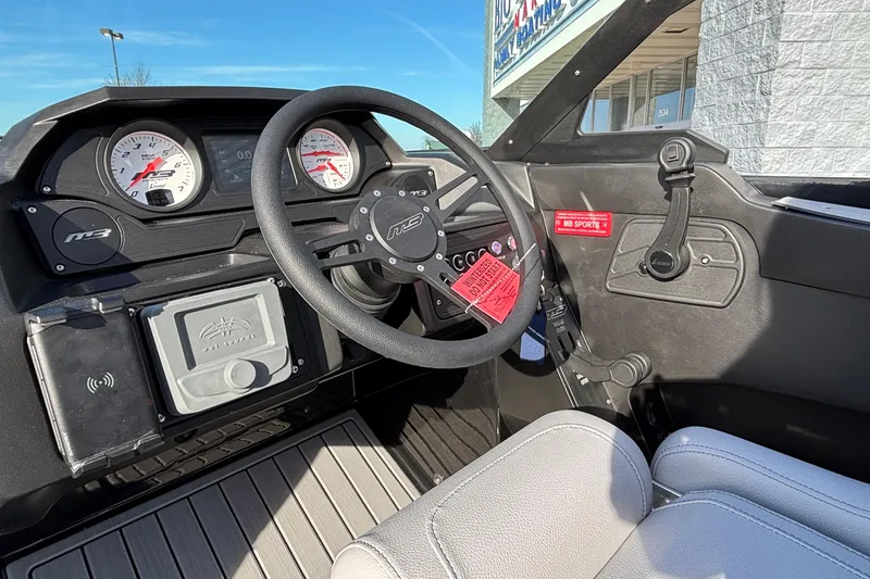 Slide: The Image of Interior view of 2026 MB B52 23 Classic boat dashboard with steering wheel and gauges. - 21