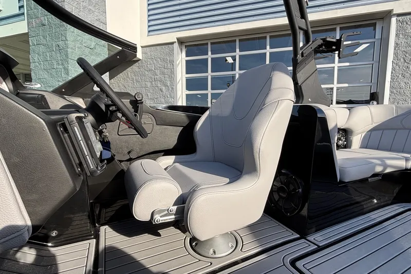 Slide: The Image of 2026 MB B52 23 Classic boat interior with modern steering and seating. - 22