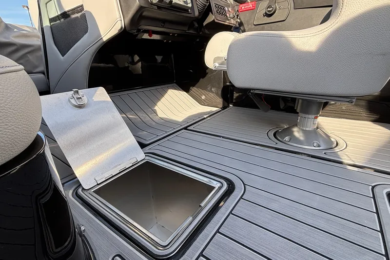 Slide: The Image of 2026 MB B52 23 Classic boat interior with open storage compartment and seating. - 23