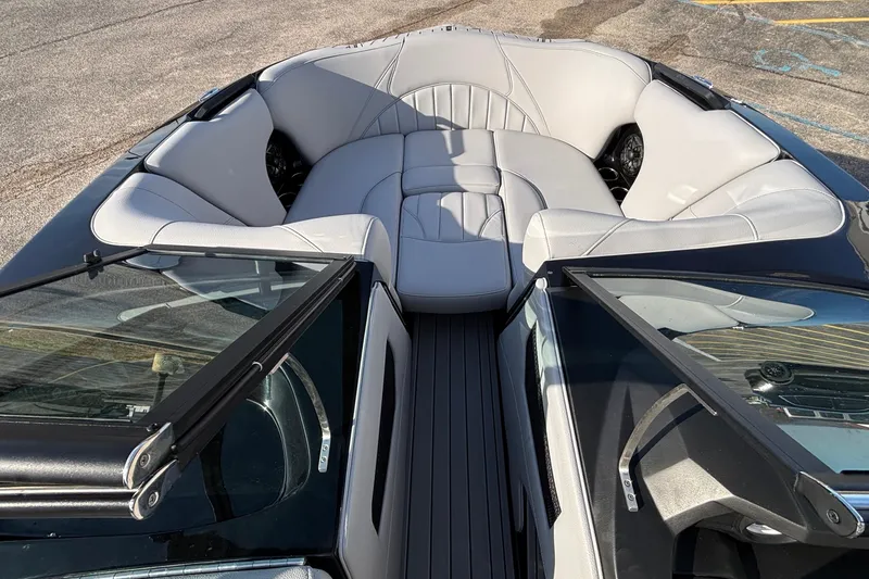 Slide: The Image of 2026 MB B52 23 Classic boat interior with luxurious seating and sleek design. - 27