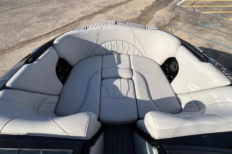 Slide: The Image of 2026 MB B52 23 Classic boat interior with luxurious gray seating and cup holders. - 28