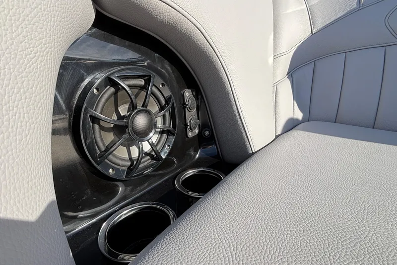 Slide: The Image of 2026 MB B52 23 Classic interior with speaker and cup holders, featuring gray leather seats. - 31