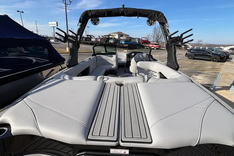 Slide: The Image of 2026 MB B52 23 Classic boat with sleek interior and modern design in a parking lot. - 34