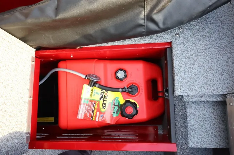 Slide: The Image of Red fuel tank in 2026 Lund 1650 Angler Sport boat compartment. - 17