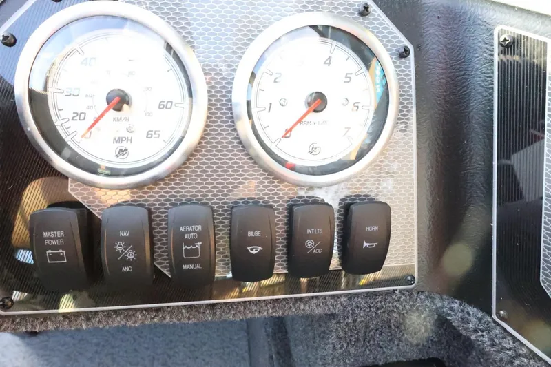 Slide: The Image of Dashboard of 2026 Lund 1650 Angler Sport boat with gauges and control switches. - 20
