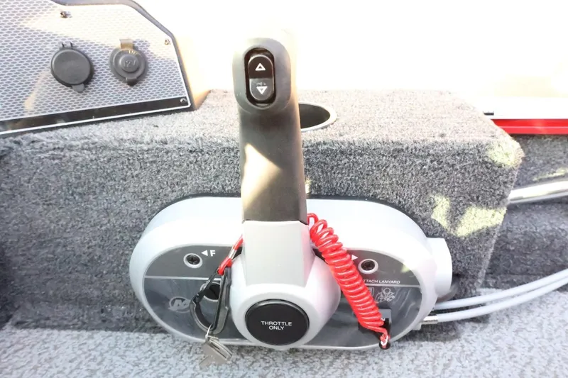 Slide: The Image of 2026 Lund 1650 Angler Sport boat throttle control with safety lanyard and key. - 21