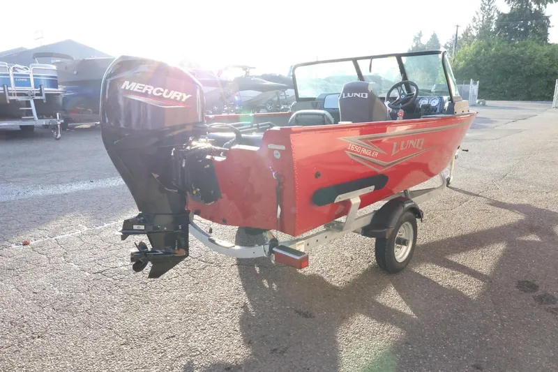 Slide: The Image of 2026 Lund 1650 Angler Sport boat with Mercury outboard engine on trailer. - 7