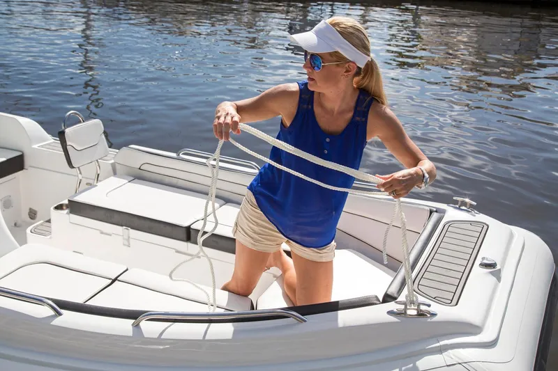 Slide: The Image of Manufacturer Provided Image: Woman handling rope on 2018 Walker Bay Generation 525 DLX boat. - 10