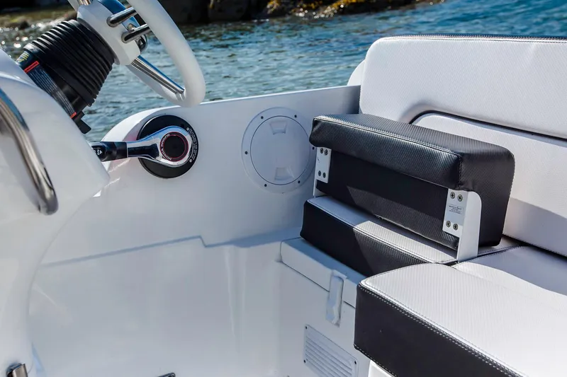 Slide: The Image of Manufacturer Provided Image: 2018 Walker Bay Generation 525 DLX boat interior with steering wheel and seating. - 14