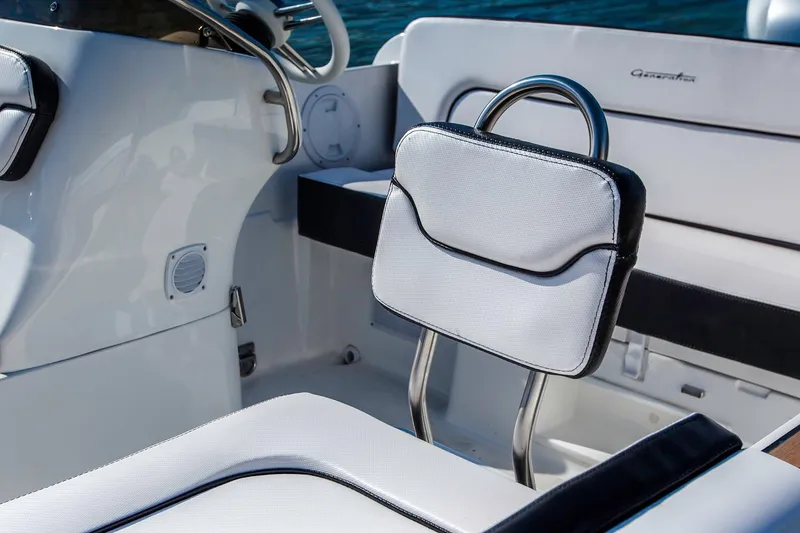 Slide: The Image of Manufacturer Provided Image: 2018 Walker Bay Generation 525 DLX boat interior with white cushioned seating. - 15