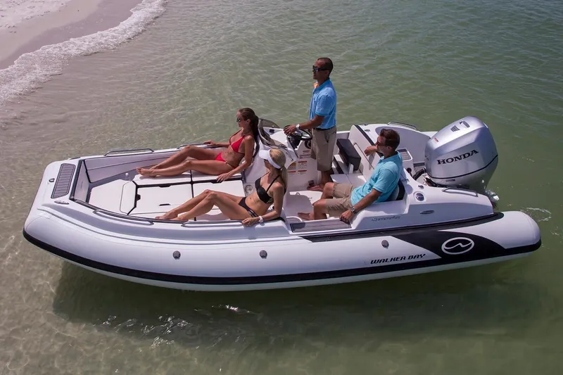 Slide: The Image of Manufacturer Provided Image: 2018 Walker Bay Generation 525 DLX boat cruising near the shore. - 7
