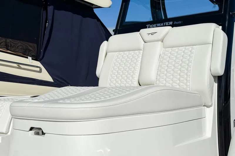 Slide: The Image of Luxurious seating on 2026 Tidewater 3100 Carolina Bay boat, featuring elegant white upholstery. - 11