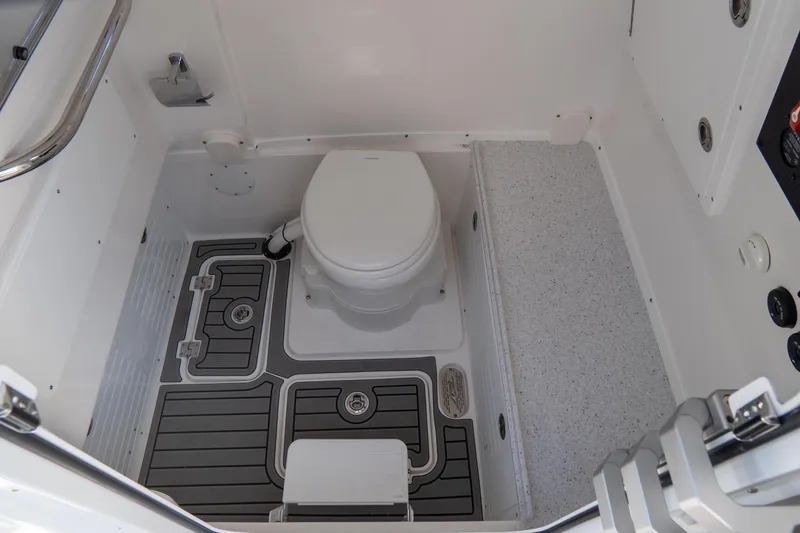 Slide: The Image of 2026 Tidewater 3100 Carolina Bay boat interior with toilet and modern flooring. - 17