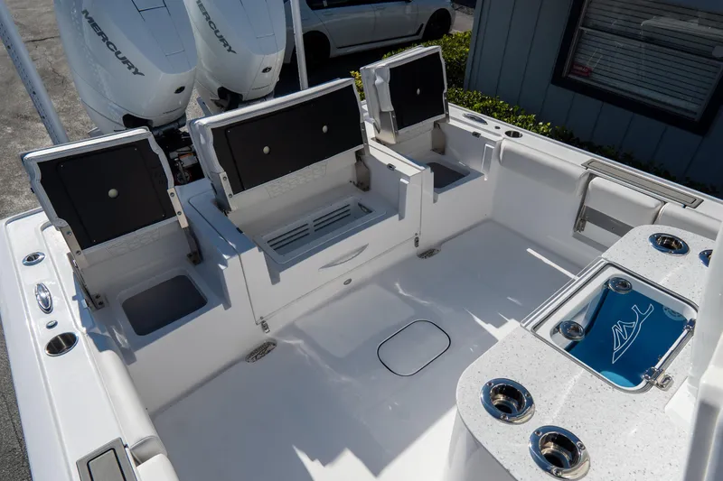 Slide: The Image of 2026 Tidewater 3100 Carolina Bay boat interior with seating and storage compartments. - 27