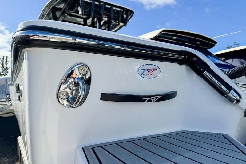 Slide: The Image of 2026 Tidewater 3100 Carolina Bay boat, sleek design with chrome details and logo. - 33