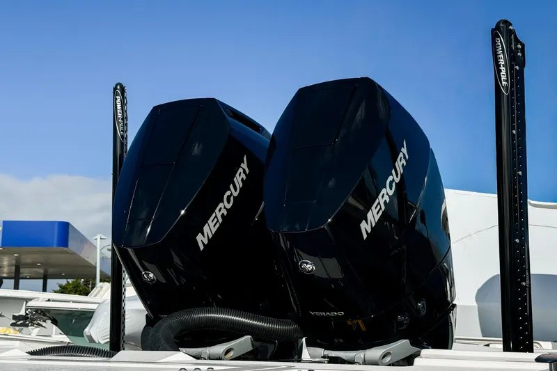 Slide: The Image of Twin Mercury outboard engines on a 2026 Tidewater 3100 Carolina Bay boat. - 34