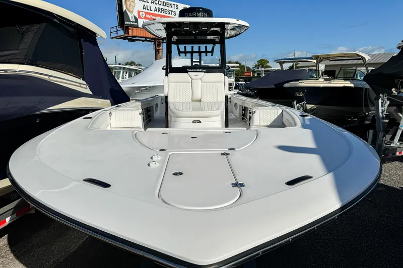 Slide: The Image of 2026 Tidewater 3100 Carolina Bay boat, sleek design, spacious deck, modern features, parked outdoors. - 4