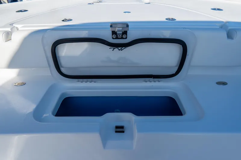 Slide: The Image of 2026 Tidewater 3100 Carolina Bay boat storage compartment, open lid, sleek design. - 9