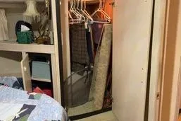 Slide: The Image of 1997 Bayliner 3788 Command Bridge Motoryacht interior closet with hangers and storage. - 19