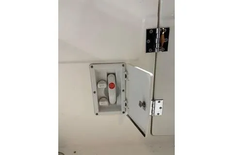 Slide: The Image of 1997 Bayliner 3788 Command Bridge Motoryacht electrical panel with open access door. - 28