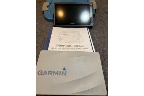 Slide: The Image of Garmin GPSMAP device with owner's manual for Bayliner 3788 Command Bridge Motoryacht, 1997 model. - 32