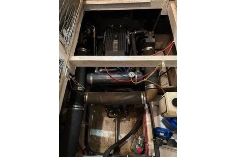 Slide: The Image of 1997 Bayliner 3788 Command Bridge Motoryacht engine compartment with visible wiring and components. - 39