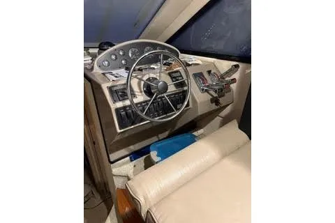 Slide: The Image of 1997 Bayliner 3788 Command Bridge Motoryacht interior kitchen with curtains and appliances. - 4