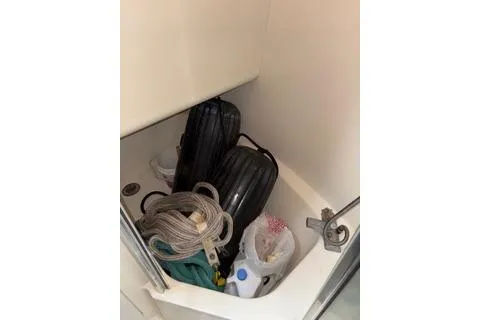 Slide: The Image of Storage compartment on 1997 Bayliner 3788 Command Bridge Motoryacht with ropes and fenders. - 41