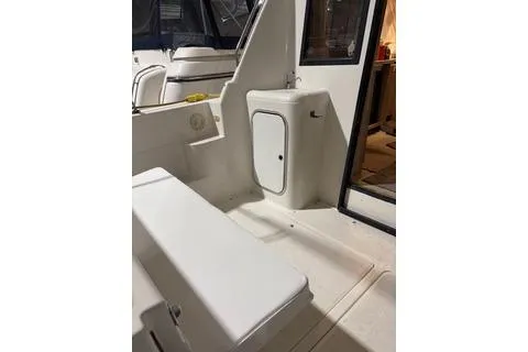 Slide: The Image of 1997 Bayliner 3788 Command Bridge Motoryacht interior with seating and storage. - 42