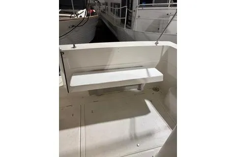 Slide: The Image of 1997 Bayliner 3788 Command Bridge Motoryacht, white bench seating on deck. - 43