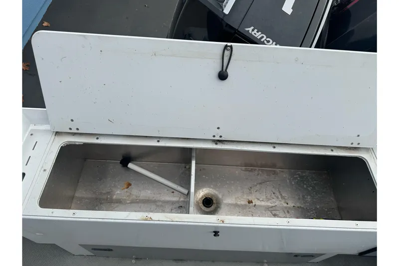 Slide: The Image of Open storage compartment on 2021 KingFisher 2025 Escape HHT boat. - 14