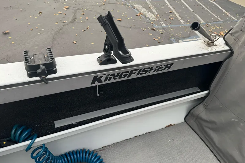 Slide: The Image of KingFisher 2025 Escape HHT boat interior with rod holders and logo, 2021 model. - 15