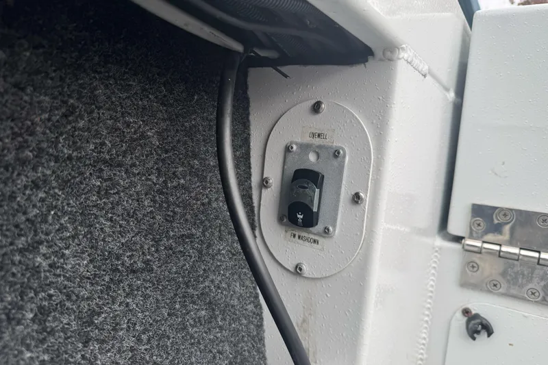 Slide: The Image of Switch panel on KingFisher 2025 Escape HHT boat, featuring livewell and washdown controls. - 17