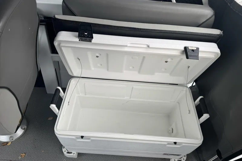 Slide: The Image of Open cooler inside a 2021 KingFisher 2025 Escape HHT boat. - 21