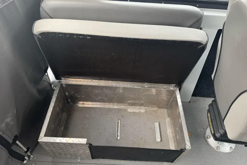 Slide: The Image of Open storage compartment in 2021 KingFisher 2025 Escape HHT boat interior. - 22