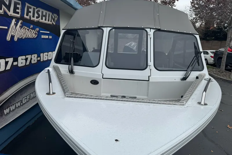 Slide: The Image of KingFisher 2025 Escape HHT boat, front view, displayed at Gone Fishin' Marine. - 5