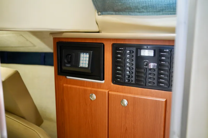 Slide: The Image of 2006 Bayliner 285 interior with control panel and safe. - 27