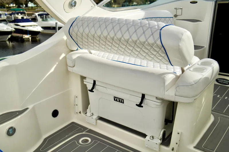 Slide: The Image of 2006 Bayliner 285 boat interior with cushioned seating and Yeti cooler. - 36