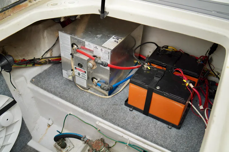 Slide: The Image of 2006 Bayliner 285 engine compartment with batteries and wiring. - 37