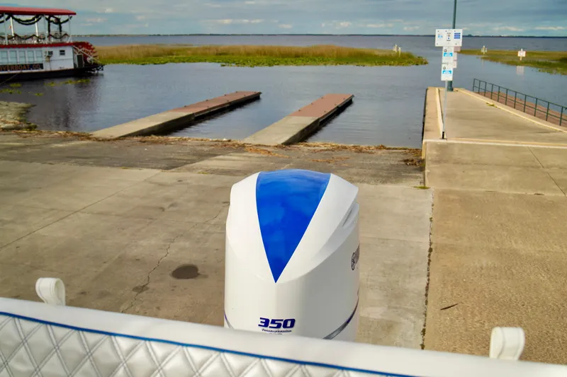 Slide: The Image of Boat launch area with Yamaha 350 engine, Bayliner 285, 2006 model, and scenic water view. - 41