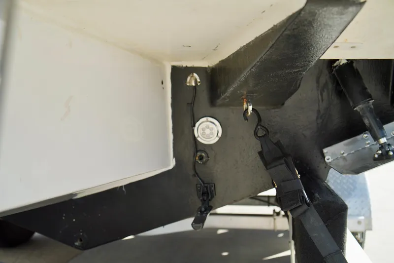 Slide: The Image of 2006 Bayliner 285 boat underside with visible hardware and components. - 46